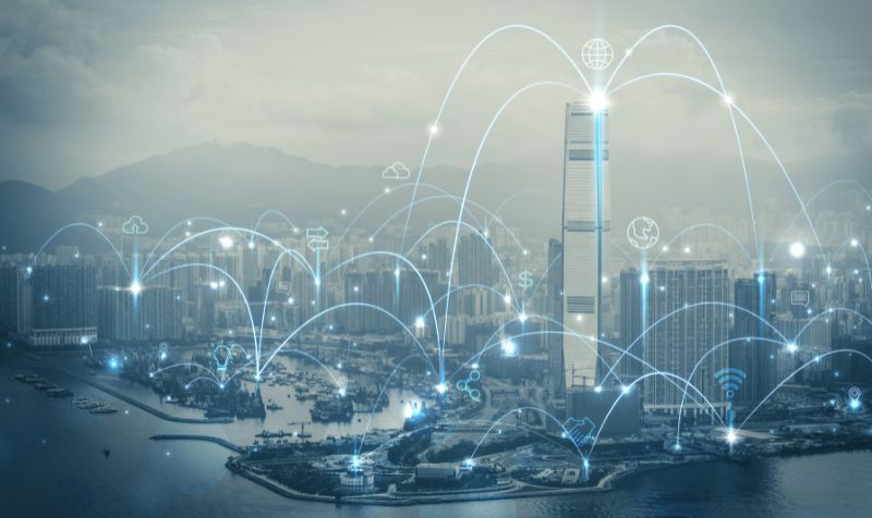 Image of city buildings interconnected through IoT technology
