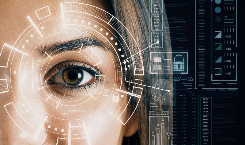 woman look up and eye with biometric data scanning and analysis on virtual screen. Face recognition and artificial intelligence. Concept of identification 