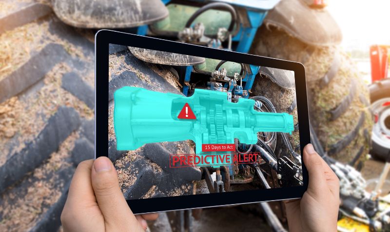 Industrial 4.0 , Augmented reality technology , smart agriculture and farm concept. Hand holding tablet with AR maintenance application and predictive alert for check destroy part of smart machine. 